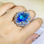 Hot Selling Simulation Sea Blue Topaz Color Treasure Opening Ring Female 925 Stamp Fashion Big Flower Ring Party Wedding Gift